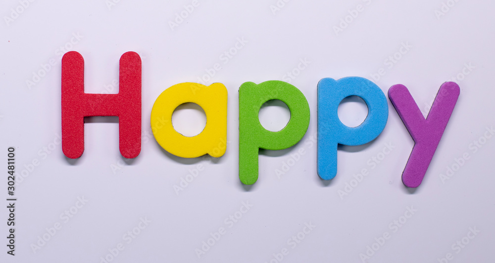 Word Happy written with color sponge