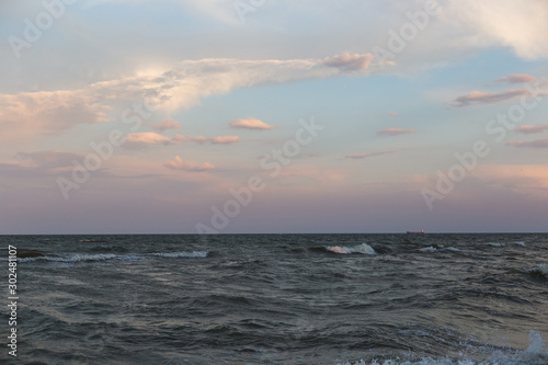 Sea landscape with waves on the water in pastel colors © bearok