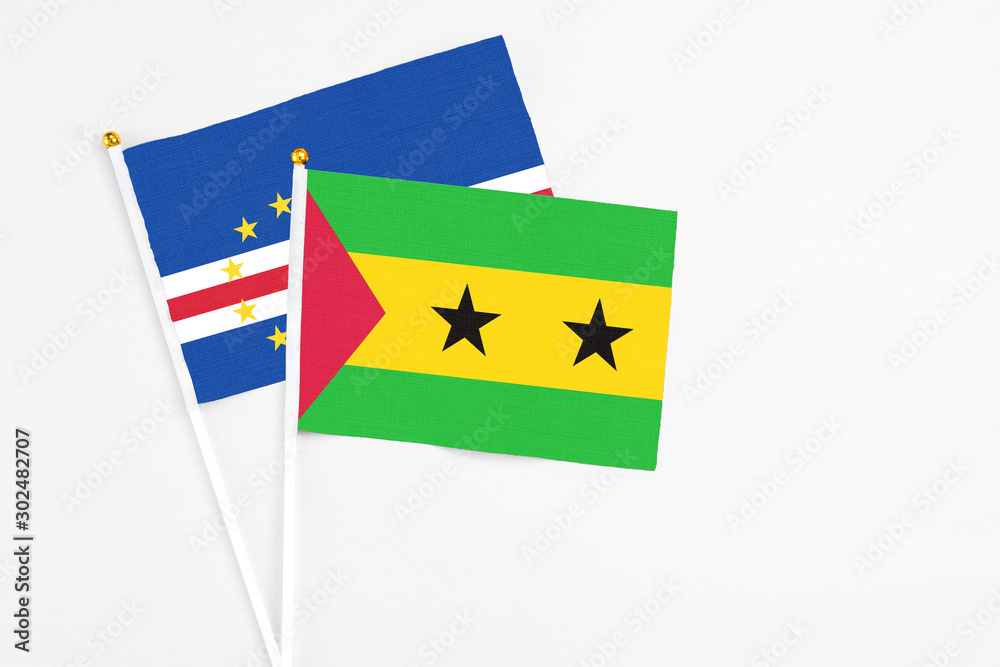 Sao Tome And Principe and Cape Verde stick flags on white background. High quality fabric, miniature national flag. Peaceful global concept.White floor for copy space. Sao Tome And Principe and Cape Verde stick flags on white background. High quality fabric, miniature national flag. Peaceful global concept.White floor for copy space.