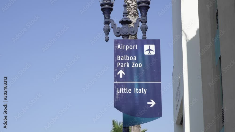 airport balboa park zoo little ittaly san diego california street sign. Blue sky background 