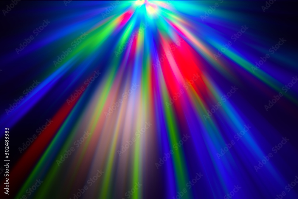 Multicolored rays of light shine through the facets of the crystal