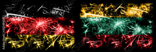 Germany, German vs Lithuania, Lithuanian New Year celebration travel sparkling fireworks flags concept background. Combination of two abstract states flags.