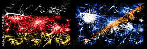Germany, German vs Marshall Islands New Year celebration travel sparkling fireworks flags concept background. Combination of two abstract states flags. © Vlad