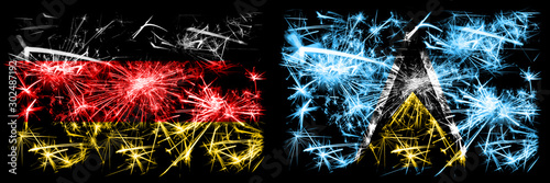 Germany, German vs Saint Lucia New Year celebration travel sparkling fireworks flags concept background. Combination of two abstract states flags. © Vlad
