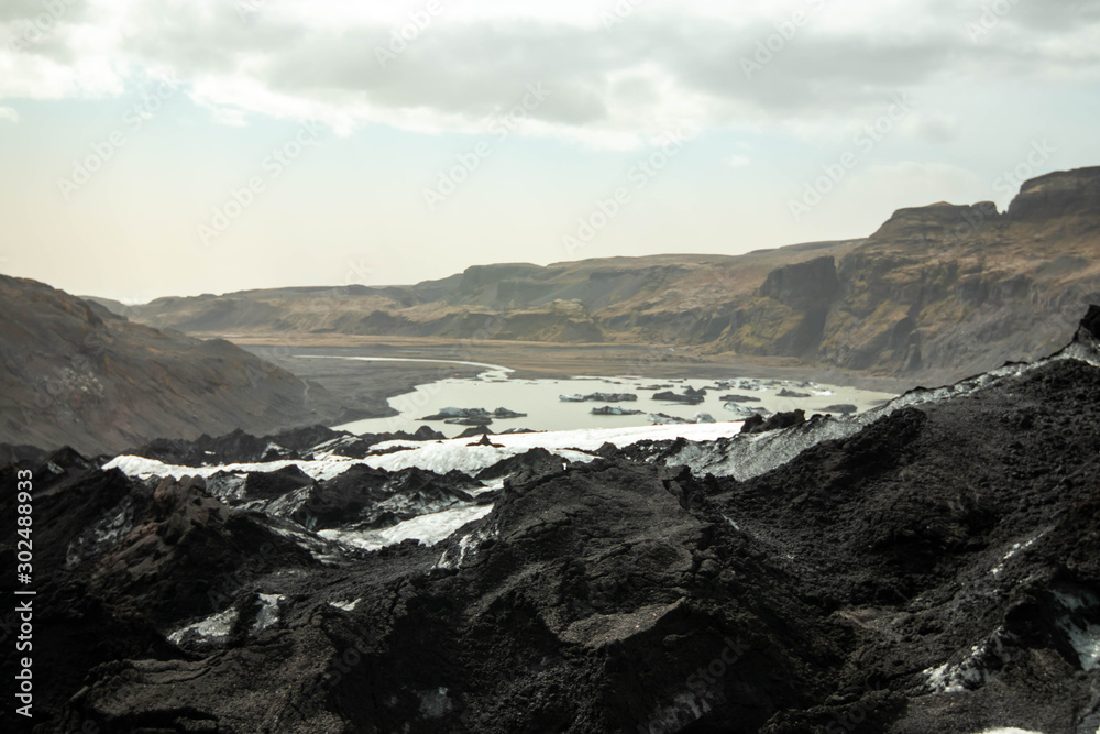 View from the ash covered Solheimajokull glacier toward the fjord