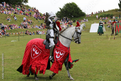 Knight on horseback at a joust recreation for a family day out photo