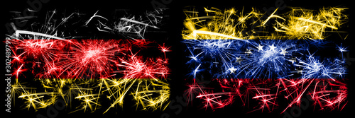 Germany, German vs Venezuela, Venezuelan New Year celebration travel sparkling fireworks flags concept background. Combination of two abstract states flags. © Vlad