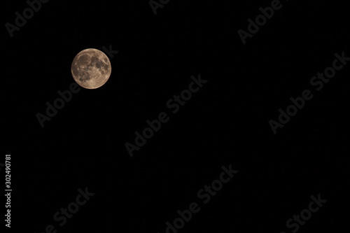 Big full moon on the black sky at night