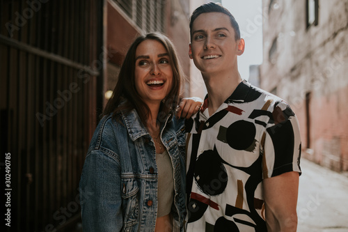 Portrait of young urban couple on street