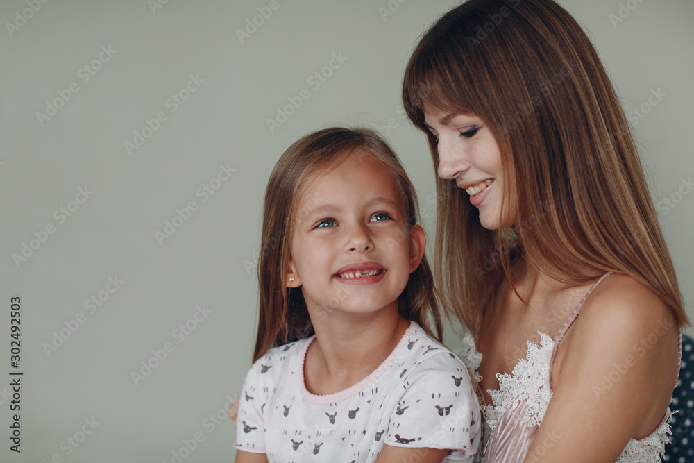 Mother with a little daughter smiling. Family and mother's day concept. Mother with a little daughter smiling. Family and mother's day concept.
