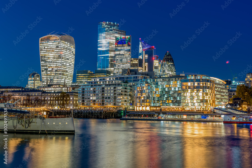 London Evening cityscape with a museum boat and skyscrapers London Evening cityscape with a museum boat and skyscrapers