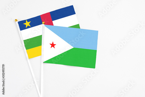 Djibouti and Central African Republic stick flags on white background. High quality fabric, miniature national flag. Peaceful global concept.White floor for copy space. Free Download Djibouti and Central African Republic stick flags on white background. High quality fabric, miniature national flag. Peaceful global concept.White floor for copy space. - GFXLoad
