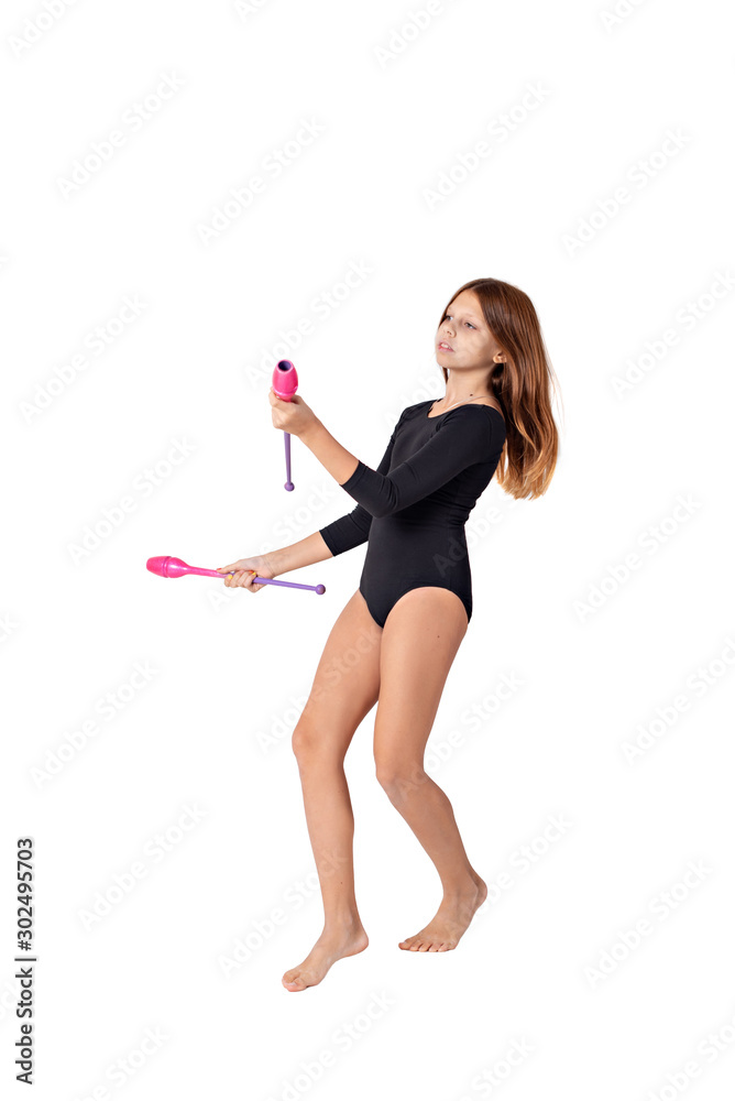 girl gymnast trains with a gymnastic clubs on white background. children's professional sports. girl gymnast trains with a gymnastic clubs on white background. children's professional sports.