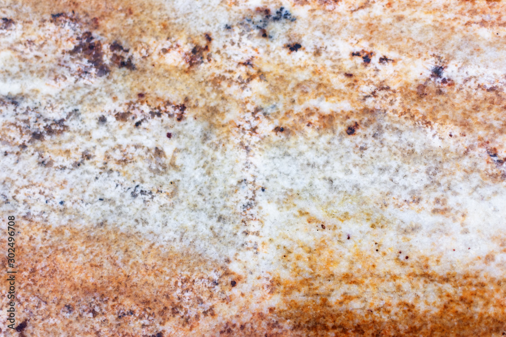 Texture of golden granite stone. Golden marble background. Texture of golden granite stone. Golden marble background.