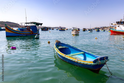 Marsaxlokk. Traditional boats Luzzu in the old harbor. photo