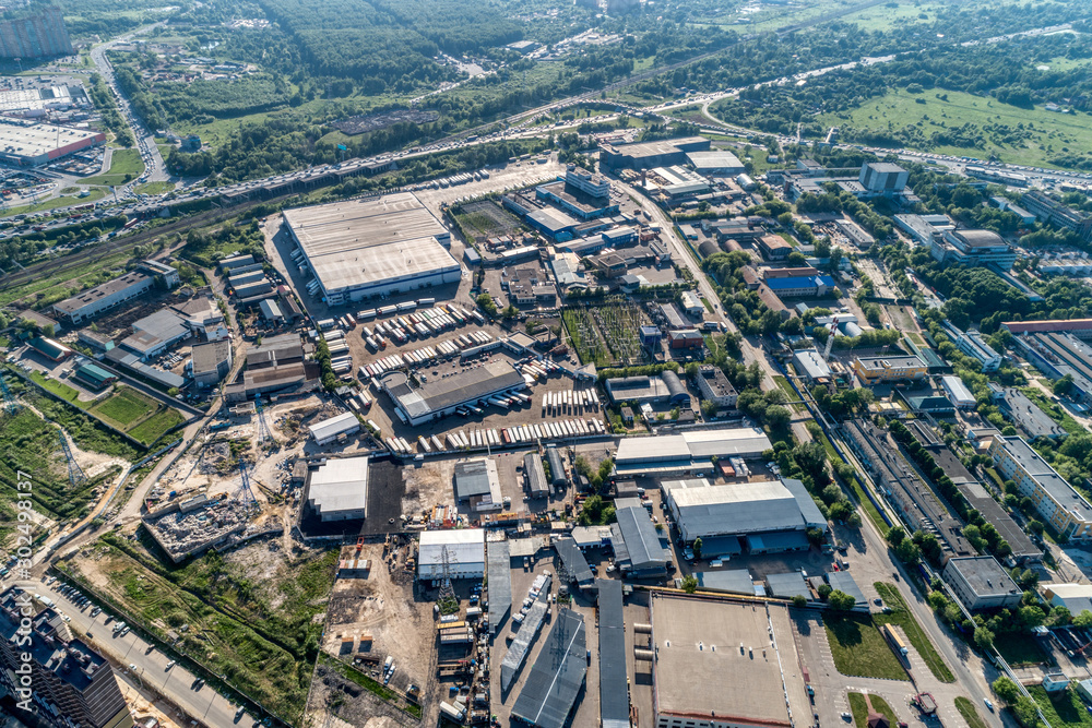 The outskirts of a big city. Aerial view, sunny summer day.