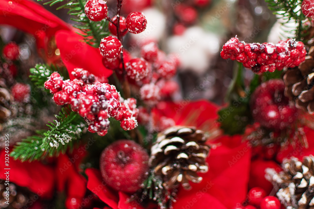 Fake plant of pine needles, pine cone and red berries for Christmas home decoration. - obrazy, fototapety, plakaty 