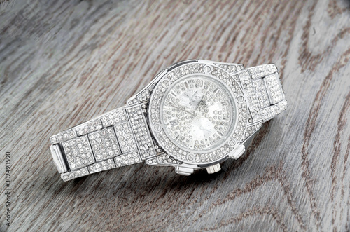 Modern watches with shiny pastes and gems
