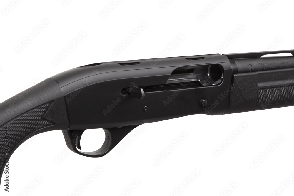 Modern black shotgun isolate on white background. Black semi-automatic shotgun on a light background. Modern black shotgun isolate on white background. Black semi-automatic shotgun on a light background.