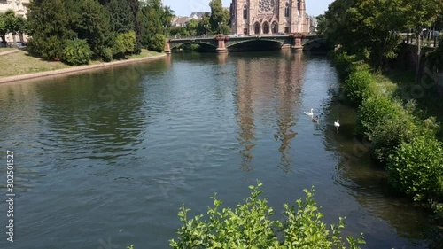 Strasbourg, France. August 2019. View on the St. Paul Church from the Ill river. 25 fps tilt movement. photo