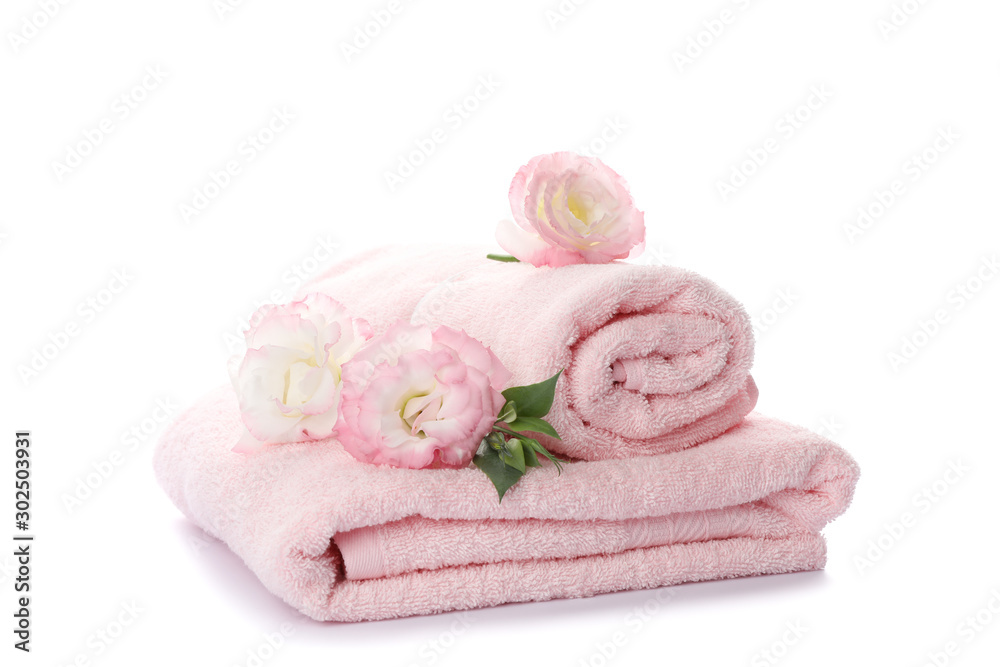 Pink towels and flowers isolated on white background Pink towels and flowers isolated on white background