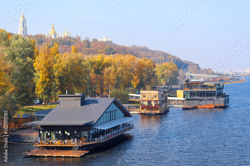 Floating restaurants on the banks of the Dnieper in autumn in Kiev photo