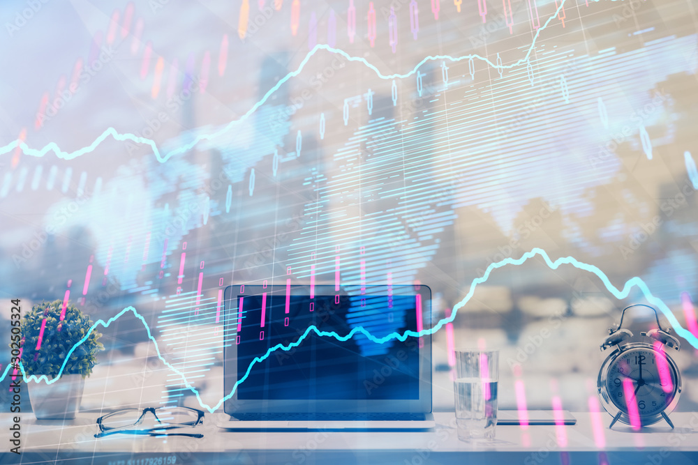 Forex Chart hologram on table with computer background. Multi exposure. Concept of financial markets. Forex Chart hologram on table with computer background. Multi exposure. Concept of financial markets.