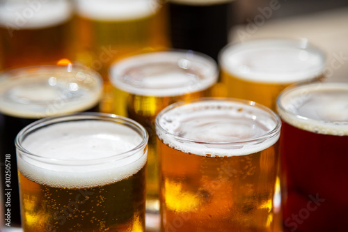 Close up on a tray of craft beer taster glasses photo