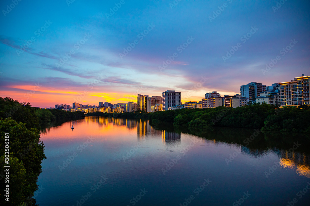 Sanya Cityscape with Sanya River View and Apartment Buildings in the sunset time, Hainan Province, China
