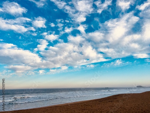 blue clouded sky with beach