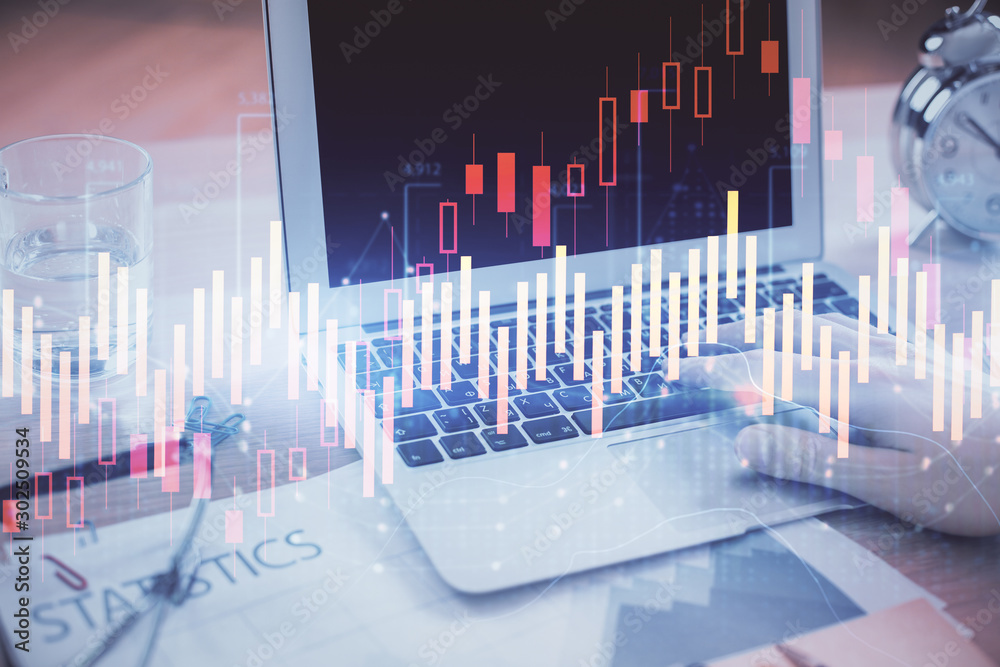 Multi exposure of market chart with man working on computer on background. Concept of financial analysis. Multi exposure of market chart with man working on computer on background. Concept of financial analysis.