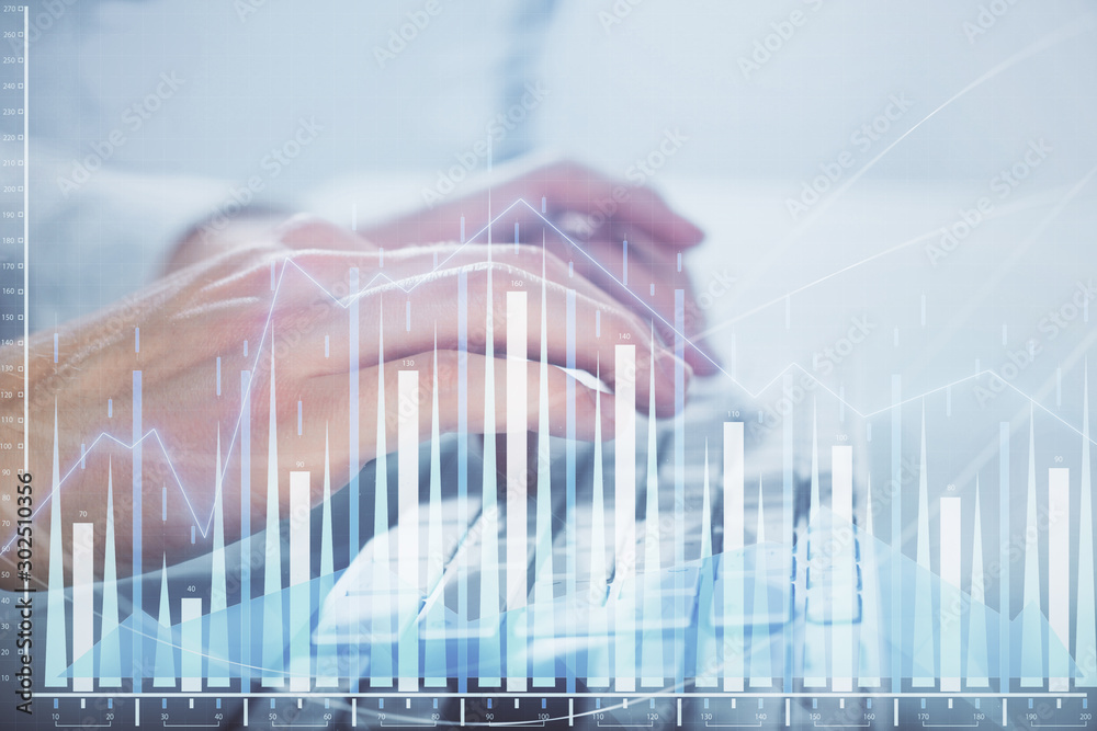 Multi exposure of graph with man typing on computer in office on background. Concept of hard work. Closeup. Multi exposure of graph with man typing on computer in office on background. Concept of hard work. Closeup.