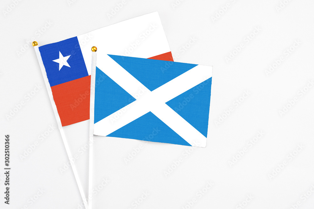 Scotland and Chile stick flags on white background. High quality fabric, miniature national flag. Peaceful global concept.White floor for copy space. Scotland and Chile stick flags on white background. High quality fabric, miniature national flag. Peaceful global concept.White floor for copy space.