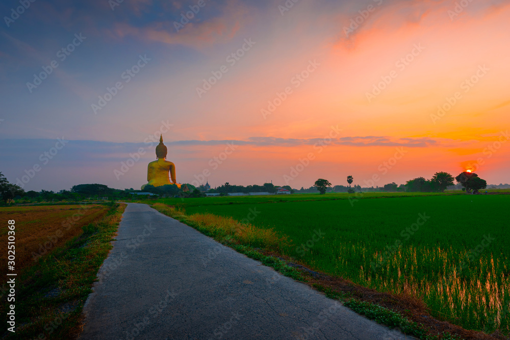  big Buddha image in the morning At Wat Muang, Ang Thong Province, Thailand.