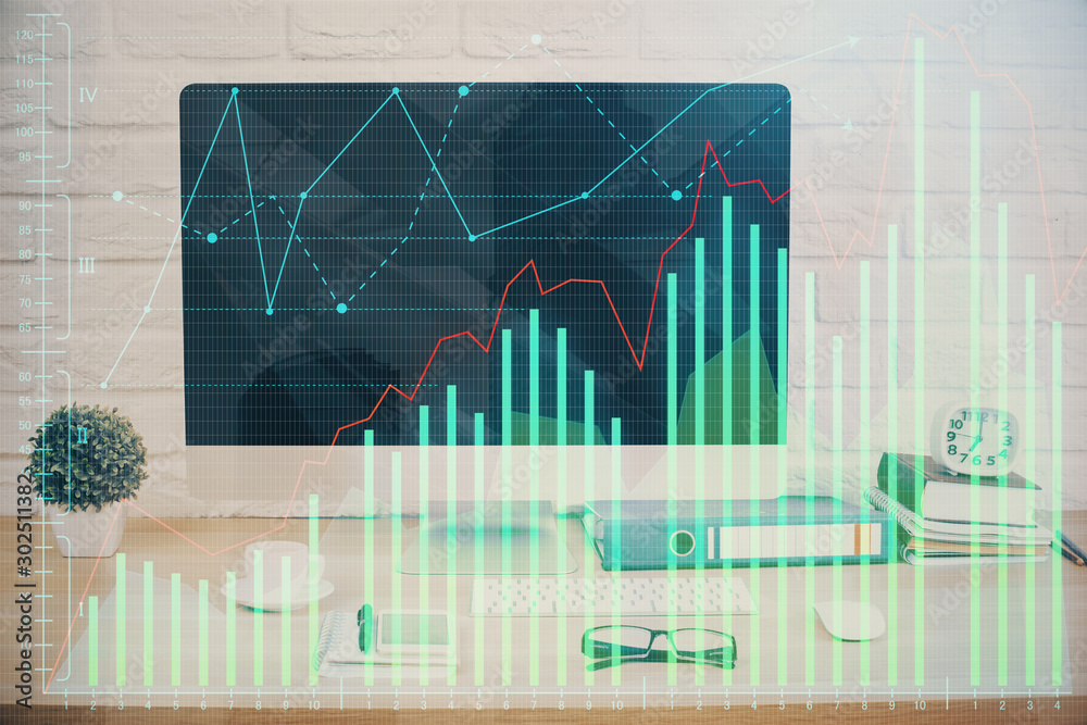 Forex graph hologram on table with computer background. Double exposure. Concept of financial markets. Forex graph hologram on table with computer background. Double exposure. Concept of financial markets.