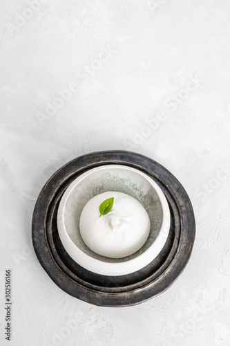 burrata cheese with basil leave top view, white background, copy space