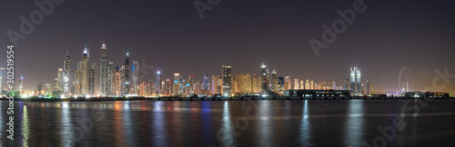 Dubai skyline panorama at night showing beautiful JBR seafront skyscrapers  © Igor Shaposhnikov