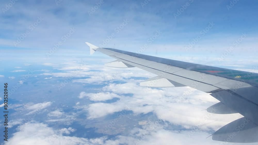 Airplane passing through the Clouds during the Landing Procedure. Landing in Winter. Condensate on the Windows. Hyperlapse