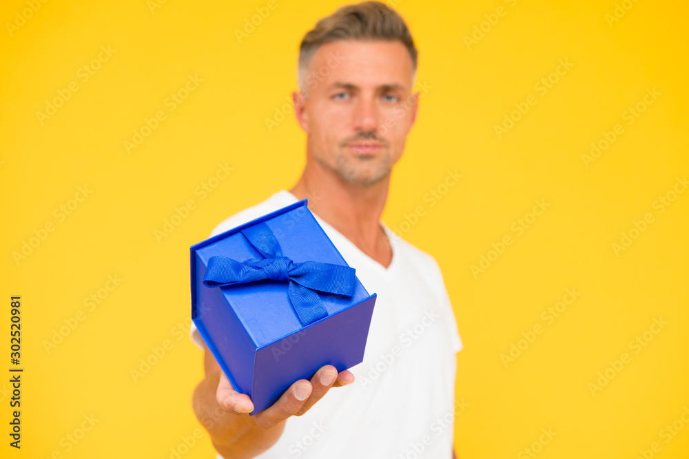 present from heart. selective focus. gift with love. happy birthday. man celebrate valentines day. goods for men. for his beloved. man gift box. macho man yellow background. man share present present from heart. selective focus. gift with love. happy birthday. man celebrate valentines day. goods for men. for his beloved. man gift box. macho man yellow background. man share present