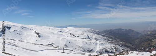 Panoramic View of Sierra Nevada The Famous Mountain Resort , Very popular tourist wainter destination in Granada , South of Spain © alexemarcel