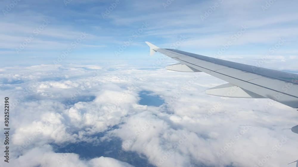 Airplane passing through the Clouds during the Landing Procedure. Landing in Winter. Condensate on the Windows. Hyperlapse