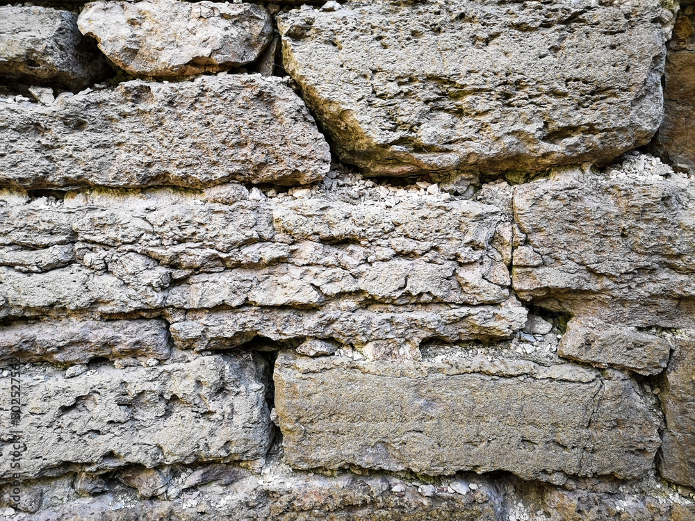 Fototapeta premium Old historic limestone wall