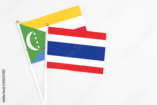 Thailand and Comoros stick flags on white background. High quality fabric, miniature national flag. Peaceful global concept.White floor for copy space. Free Download Thailand and Comoros stick flags on white background. High quality fabric, miniature national flag. Peaceful global concept.White floor for copy space. - GFXLoad