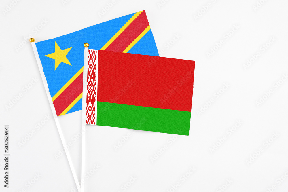 Belarus and Congo stick flags on white background. High quality fabric, miniature national flag. Peaceful global concept.White floor for copy space. Belarus and Congo stick flags on white background. High quality fabric, miniature national flag. Peaceful global concept.White floor for copy space.