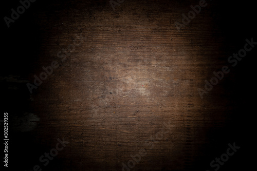 Empty dark wood background to insert. space for text.