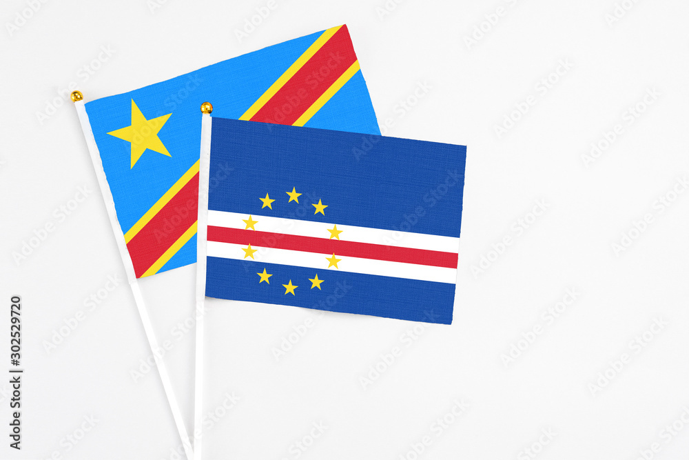 Cape Verde and Congo stick flags on white background. High quality fabric, miniature national flag. Peaceful global concept.White floor for copy space. Cape Verde and Congo stick flags on white background. High quality fabric, miniature national flag. Peaceful global concept.White floor for copy space.