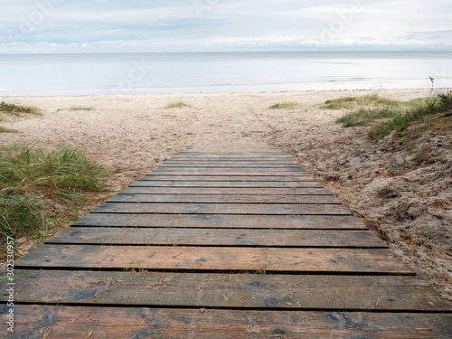 Wooden path to sandy beach  Jurmala region  Riga gulf  Latvia.