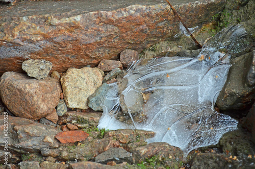 Ice over stones