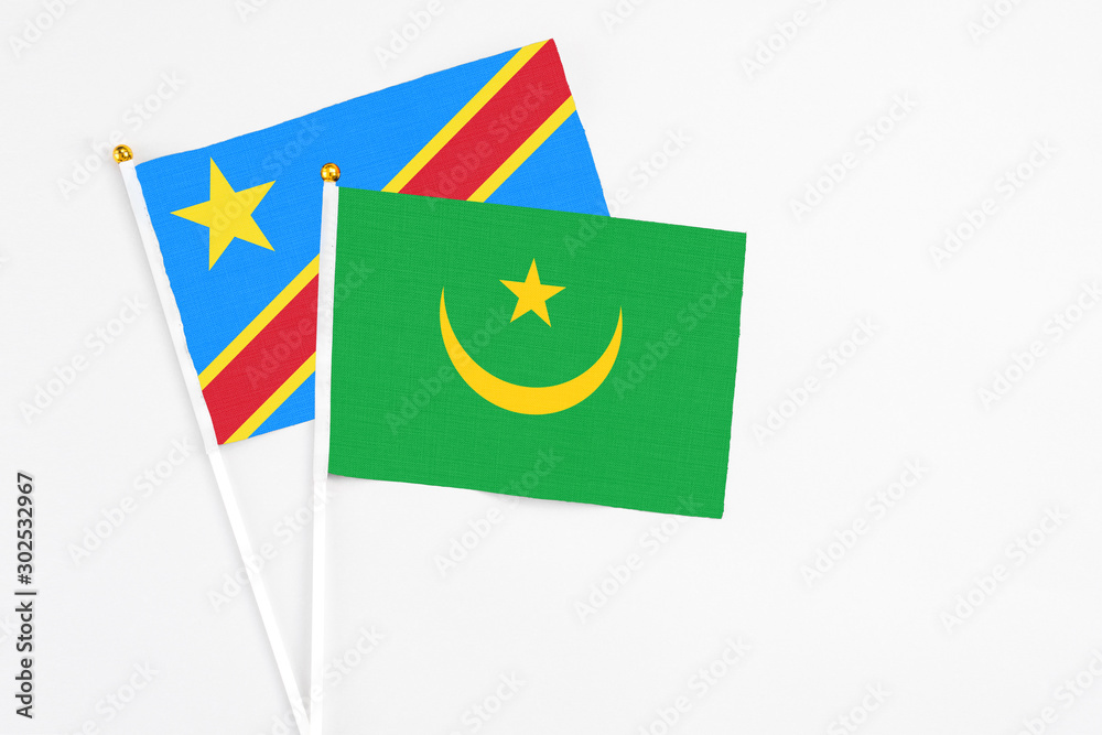 Mauritania and Congo stick flags on white background. High quality fabric, miniature national flag. Peaceful global concept.White floor for copy space. Mauritania and Congo stick flags on white background. High quality fabric, miniature national flag. Peaceful global concept.White floor for copy space.
