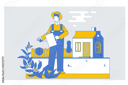 Man farmer watering a flower garden in the evening at sunset